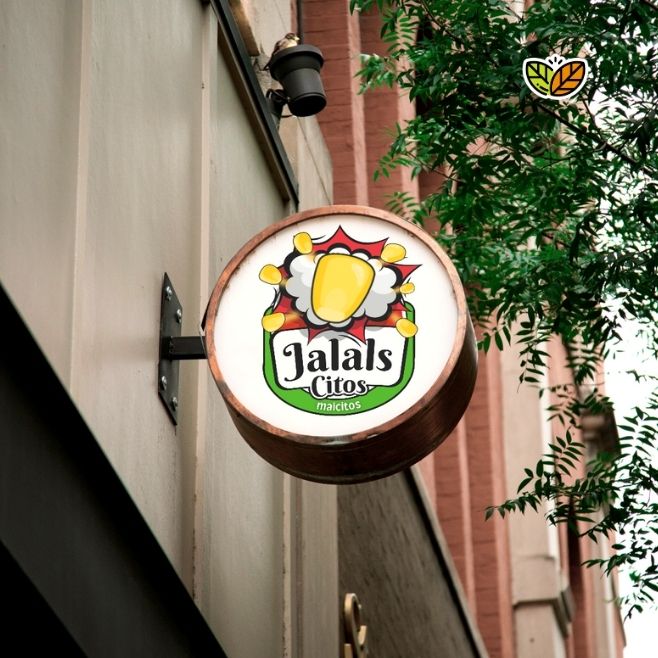 Logo creativo “Jalals Citos Maicitos” en letrero circular exterior de negocio. Diseño con mazorca amarilla y maíz inflado estilo ilustración, ideal para marca de botanas escolares y snacks saludables. Diseño de logo snacks. Logo botanas