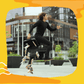 hombre de pelo largo rizado vestido de negro saltando con un maletin abierto en la mano derecha y maicitos blofis sabor salsas negras cayendo al suelo